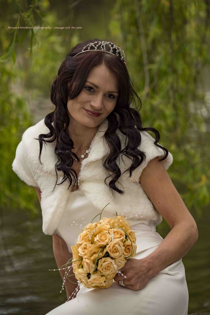 Bride resting by lake